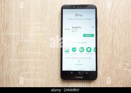 Google Pay app on Google Play Store website displayed on Huawei Y6 2018 smartphone Stock Photo