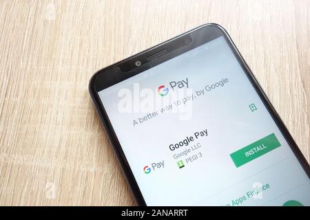 Google Pay app on Google Play Store website displayed on Huawei Y6 2018 smartphone Stock Photo