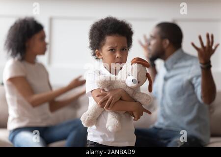 Stressed lonely kid boy suffering from family conflicts. Stock Photo