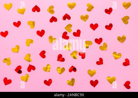 Red and golden scattered paper hearts confetti background Stock Photo