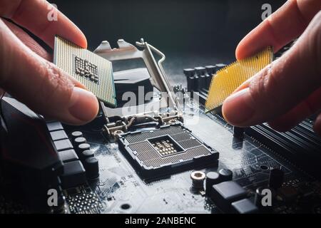 Prague, Czech Republic, January 2019 - Intel verus AMD concept. Hands show different processors. The choice of processor, Ryzen processor on rise Stock Photo