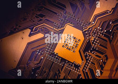 Circuit board abstract background texture. Macro close-up. Orange PCB.