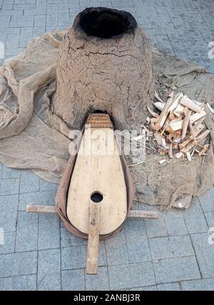 Old woodworking hand tool: wooden plane, chisel ax, sledgehammer, hammer and in a carpentry workshop on dirty rustic table covered with sawdust Stock Photo