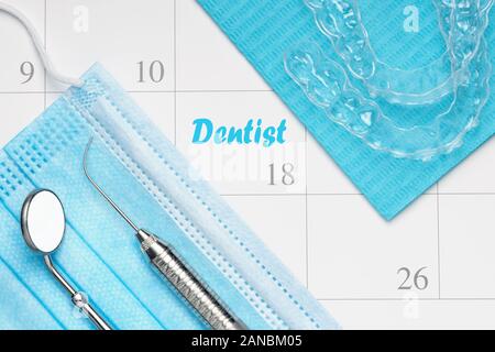 Orthodontist or Dentist appointment in calendar professional dental tools with invisalign braces. Stock Photo