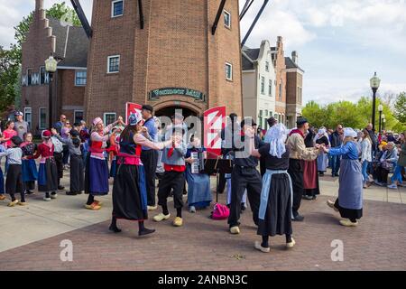 May 2, 2019, Pella, Iowa, USA. Folk dance in national dutch costume during the Tulip Time Festival Parade of Pella's dutch community Stock Photo