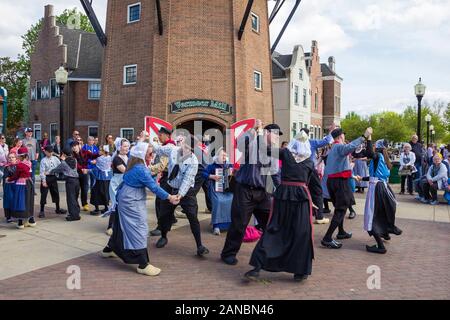 May 2, 2019, Pella, Iowa, USA. Folk dance in national dutch costume during the Tulip Time Festival Parade of Pella's dutch community Stock Photo