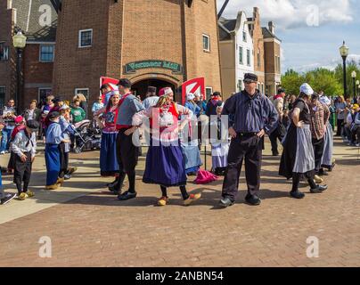 May 2, 2019, Pella, Iowa, USA. Folk dance in national dutch costume during the Tulip Time Festival Parade of Pella's dutch community Stock Photo