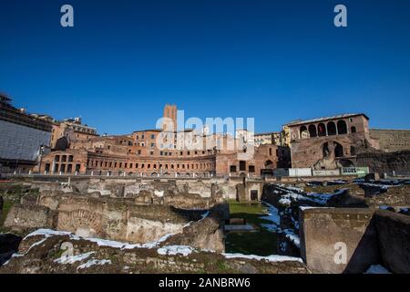 Rome, Italy, February 2018 - Snow covered Rome, winter tourism in capital city of Italy, famous travel destination in winter. Forum Romanum with snow. Stock Photo