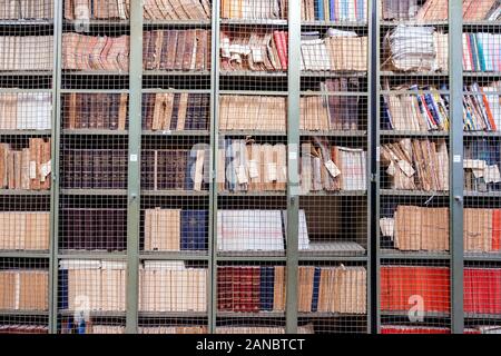 Locked bookshelves with plenty of old books Stock Photo