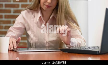 Businesswoman watching presentation on tablet, modern technology, office work Stock Photo