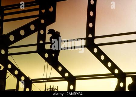 Welders working on steel girders or beams Stock Photo