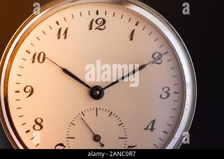 Time Passing Concept. Old Pocket Watch. Deadline, Running Out of Time and Urgency. Stock Photo