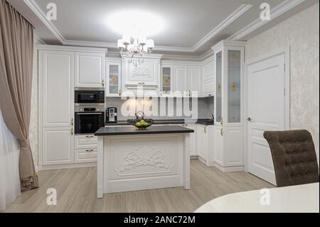 White luxury modern kitchen with island Stock Photo