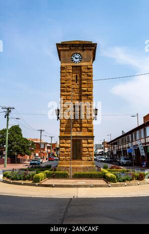 View of the War Memorial Clock Tower, made of sandstone and with a four faced clock, in Coonabarabran, New South Wales, Australia Stock Photo