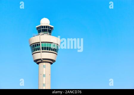 Air control tower on an airport in the Netherlands against a blue sky with copy space Stock Photo