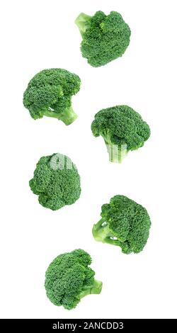 Falling broccoli isolated on a white background. Flying vegetables for packaging design. Healthy natural food. Organic vegetables. Stock Photo