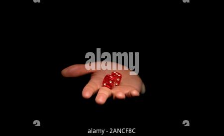 Male hand holding gambling dice, luck and fortune in casino games, concept Stock Photo