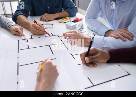 Elevated View Of An Architects Drawing Plan On Blueprint With Electrical Components Stock Photo