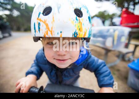 One year old girl biking with determination. Stock Photo