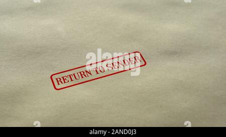 Return to Sender seal stamped on blank paper background, delivery failed Stock Photo