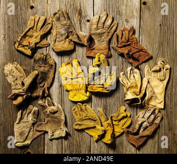 Studio still life close-up of worn leather work gloves