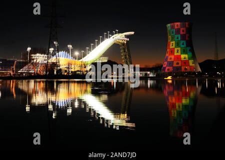 The Shougang Ski Jumping Platform turns on light for test at night, resembling a pair of large shining crystal high-heeled shoes, Beijing, China, 11 D Stock Photo