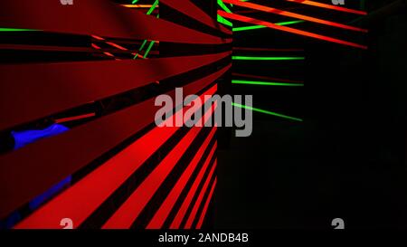 Neon colored bands in a dark room. Stock Photo