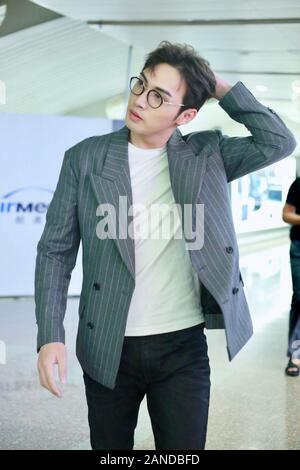 --FILE--Chinese actor Zhang Binbin, also known as Vin Zhang, talks with his companions at an airport in Beijing, Chinese, 19 July 2019. *** Local Capt Stock Photo