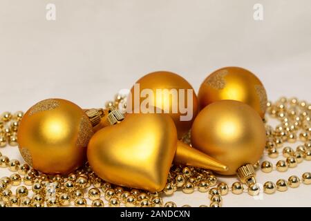 Gold colored Christmas decoration on a white background Stock Photo