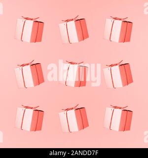Seemless pattern of craft cardboard gift boxes on the solid pink background. Holiday and gift concept. Pop art slyle. Square. Living coral theme - color of the year 2019 Stock Photo
