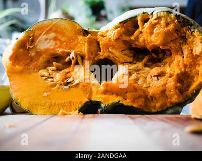 Preparing and cutting a fresh bio pumpkin Stock Photo