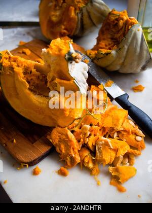 Preparing and cutting a fresh bio pumpkin Stock Photo