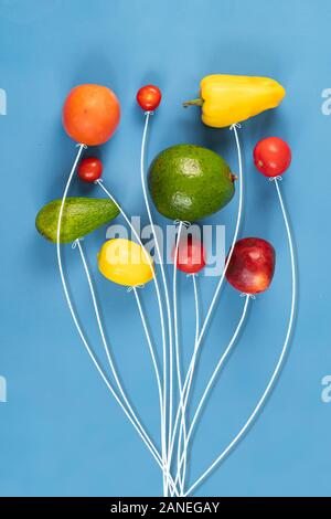a creative concept of mix of bunch of fruit fly in the air like balloon Stock Photo