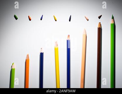 Different colors of pencils, in a pattern. Colored crayons arranged in a meaningful way. Be always sharp and stay above. Stock Photo