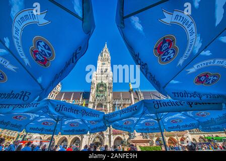 Munich Town Hall at Marienplatz with Hacker-Pschorr Beer umbrellas as the foreground. Munich, Germany. Stock Photo