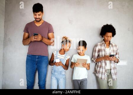 Family sharing there privacy data by using digital devices, phones, tablets Stock Photo