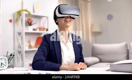 Excited corporate worker in vr goggles, modern innovation, online technology Stock Photo