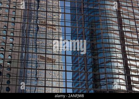 blue sky reflections in office windows in central Hong Kong Stock Photo