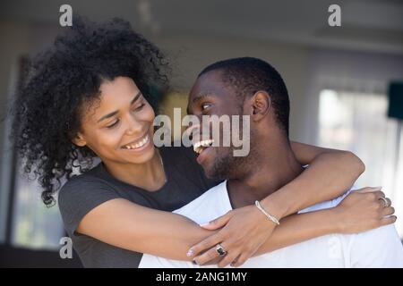 Portrait of happy black couple hugging having fun together Stock Photo