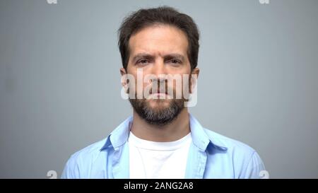 Sad middle-aged man looking into camera, unemployment, social insecurity Stock Photo