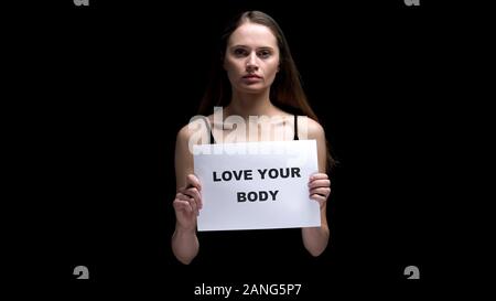 Woman showing love your body sign, accepting individuality as beauty, freedom Stock Photo