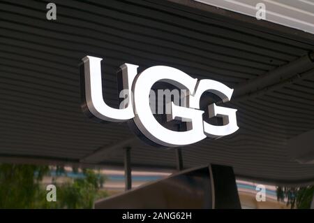 Brisbane, Queensland, Australia - 10th January 2020 : View of an illuminated UGG sign hanging in front of the store in Queenstreet mall in Brisbane.UG Stock Photo