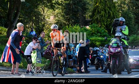 Dutch (Van Vleuten) road racing cyclist riding uphill, competing in cycle race & cheered on by supporters - UCI World Championships, Harrogate, GB, UK Stock Photo