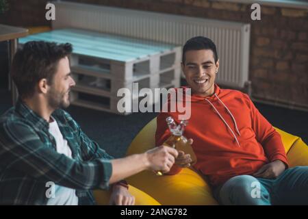 Positive good looking men relaxing in the evening Stock Photo