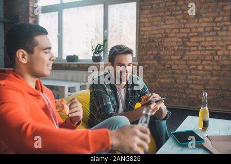 Positive nice friends having fun time at home Stock Photo