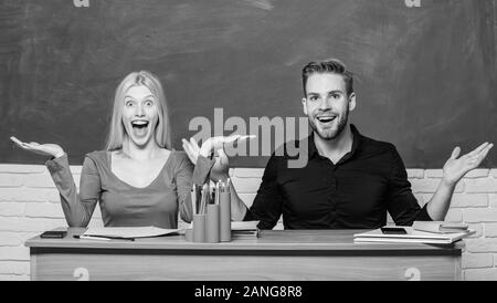 Relations with classmates. Students communicate classroom chalkboard background. Education concept. Communication between group mates. Friendship and Stock Photo