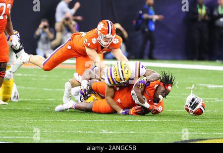 Clemson Tigers wide receiver Justyn Ross (8) loses his helmet while getting tackled against the LSU Tigers during the NCAA College Football Playoff national championship game Monday, Jan. 13, 2020, in New Orleans. LSU defeated Clemson 42-25. (Photo by IOS/ESPA-Images) Stock Photo