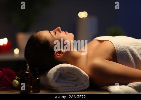 Beautiful young woman spending time in spa salon Stock Photo