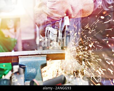 Metal cutting with angle grinder with sparks Stock Photo