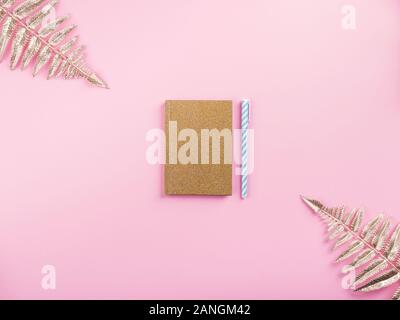 Golden branches and agenda on pink millennial Stock Photo